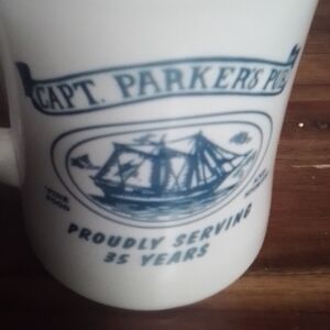 White Ceramic Mug with Blue Ship Graphic